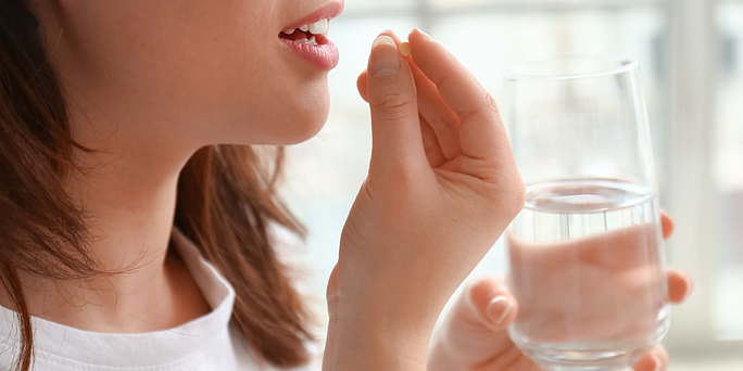 woman taking a methotrexate abortion pill